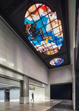 "Go," a hand-painted glass triptych in Moynihan by the artist Kehinde Wiley