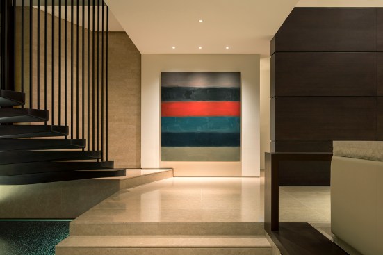 The lighting vocabulary is streamlined to showcase the artwork and focal point elements.