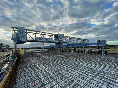 A robot supervisor gets ready to prepare Advance Construction Robotics' IronBOT for lifting, carrying, and placing rebar on the St. Lucie West Boulevard Bridge Expansion project in St. Lucie, Florida.
