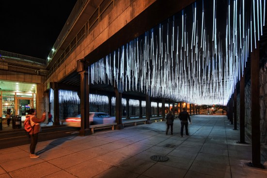 Comprising approximately 4,000 LED-illuminated polycarbonate rods, Rain, by Thurlow Small and NIO Architects, pulses in response to vehicular traffic.