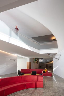 The architects incorporated informal gathering spaces, such as this lower-level education lounge, wherever possible. Most are outfitted with custom furniture and carpets.
