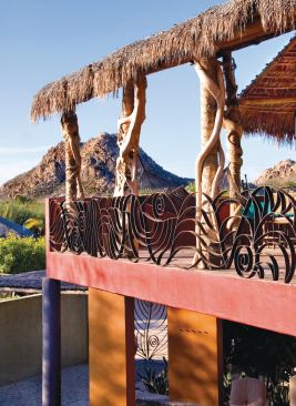 Transparent hurricane fabric protects the house's glass openings and solar panels.