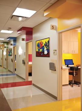 Pops of color provide visual relief throughout the facility, including the various patient exam areas.