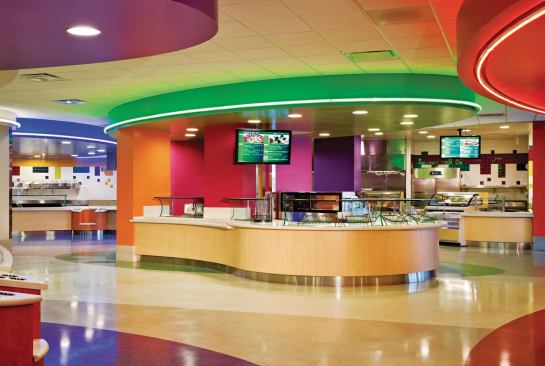 Pops of color provide visual relief throughout the facility, including the common cafeteria.