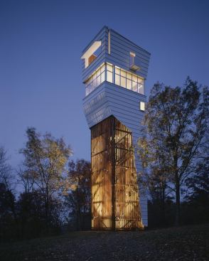At the Keenan TowerHouse in Fayetteville, a permeable oak screen contrasts with  industrial-style standing seam metal.