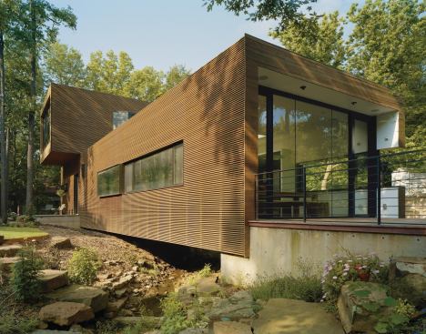 The Blackwells' home, known as the L-Stack House, spans a seasonal creek.