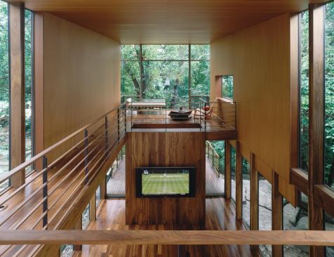 The interior of the Johnson, Ark., house includes an extended living room clad in weathering steel and lined with a rich mix of walnut and cherry.