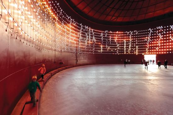 After spending 30 minutes in the all-red interior, visitors exiting Silo 468 will perceive complementary and contrasting colors—such as the blue water and sky, and the green of nearby trees—as more intense, designer Tapio Rosenius says. At midnight, the deep red hue seeps to the silo’s exterior when, for one hour, the surface is awash in red lights, a reminder that the silo was once an energy source.