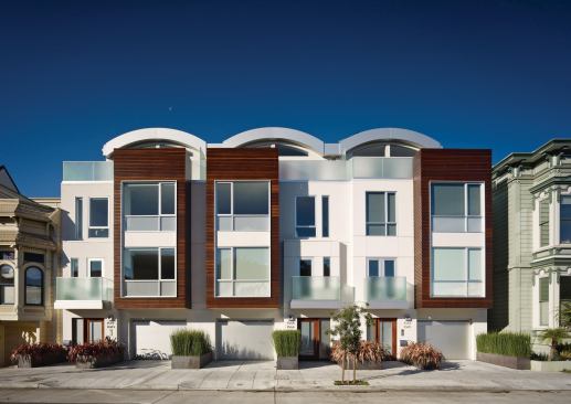 Exteriors are clad in FSC hardwood rainscreens and white fiber-cement panels.