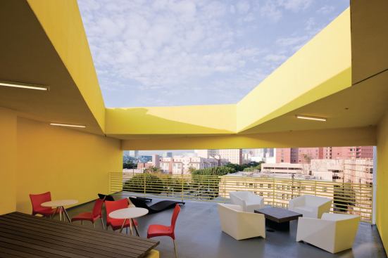On the top floor is an open-air lounge accessible to all residents. One of the goals of the New Carver Apartments design was to create a supportive space for the residents, many of whom are older adults with chronic illnesses or disabilities. Open lounges promote social interaction and help bring the formerly homeless residents out of isolation.