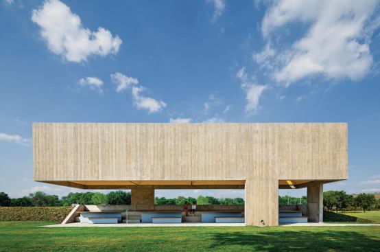 The poured-in-place concrete roof structure of the Webb Chapel Park Pavilion provides shade from the intense Dallas sun.