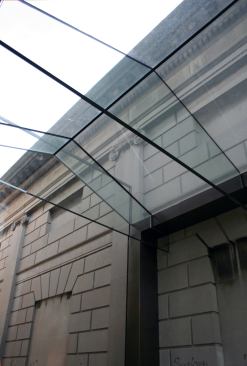 The walls, roof, and floor are all made from low-iron laminated glass, and the roof structure is supported by glass beams.