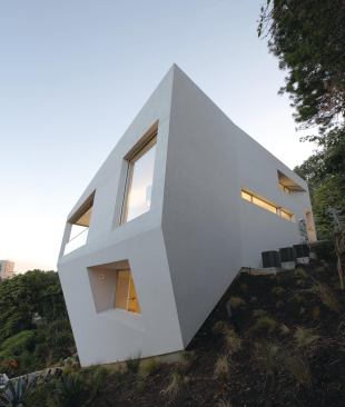 Johnston Marklee designed the Hill House in Pacific Palisades, Calif., a 3,600-square-foot single family residence completed in 2004, for an irregularly shaped hillside lot. The program sought to maximize the allowable volume permitted by zoning regulations while minimizing the house’s foundations and footprint. 
