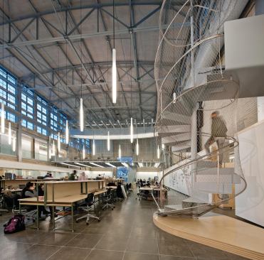 A spiral staircare connects the new mezzanine, or "the crib," to the lower level.