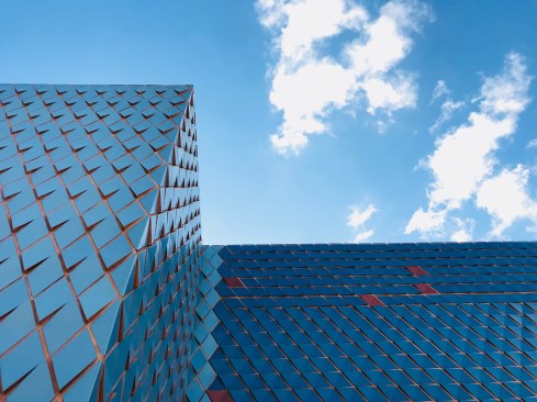 Tolila + Gilliland says that its tiles, laid out in "a variety of patterns, ... is reinforced by the nuances of color which vibrate under the Miami sun."