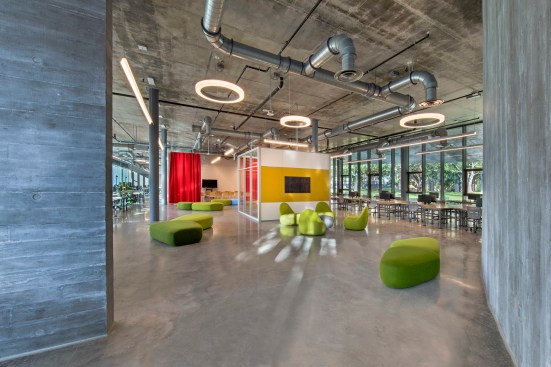 Lounge furniture lies between the west entrance (foreground) and a faculty office (at center)—one of very few enclosed areas on the studio floor