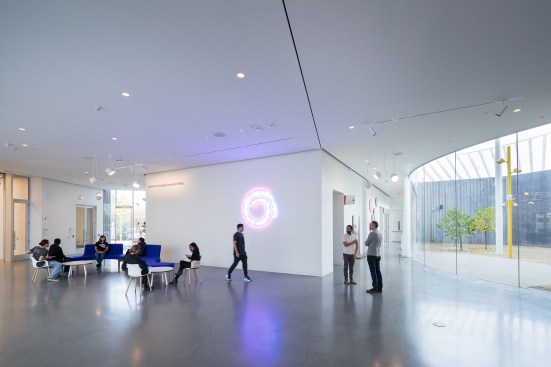 An interior courtyard fills the space between the office and gallery wings