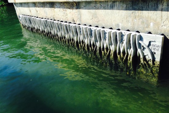 Root patterns and textured surface designed to improve habitat on mangrove-inspired seawall prototype.