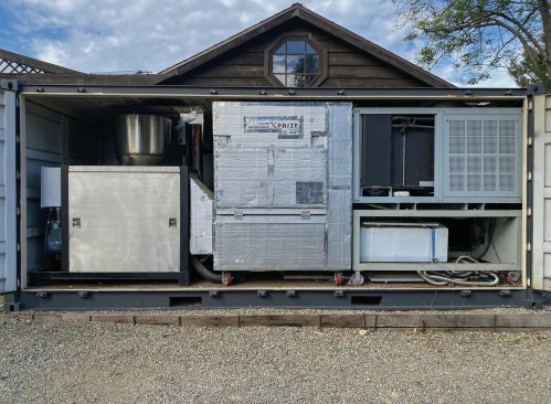 WEDEW generates renewable energy, heat, cooling, biochar, and water inside a 20-foot modified shipping container while sequestering atmospheric carbon into useful applications (Malibu, California, 2021)